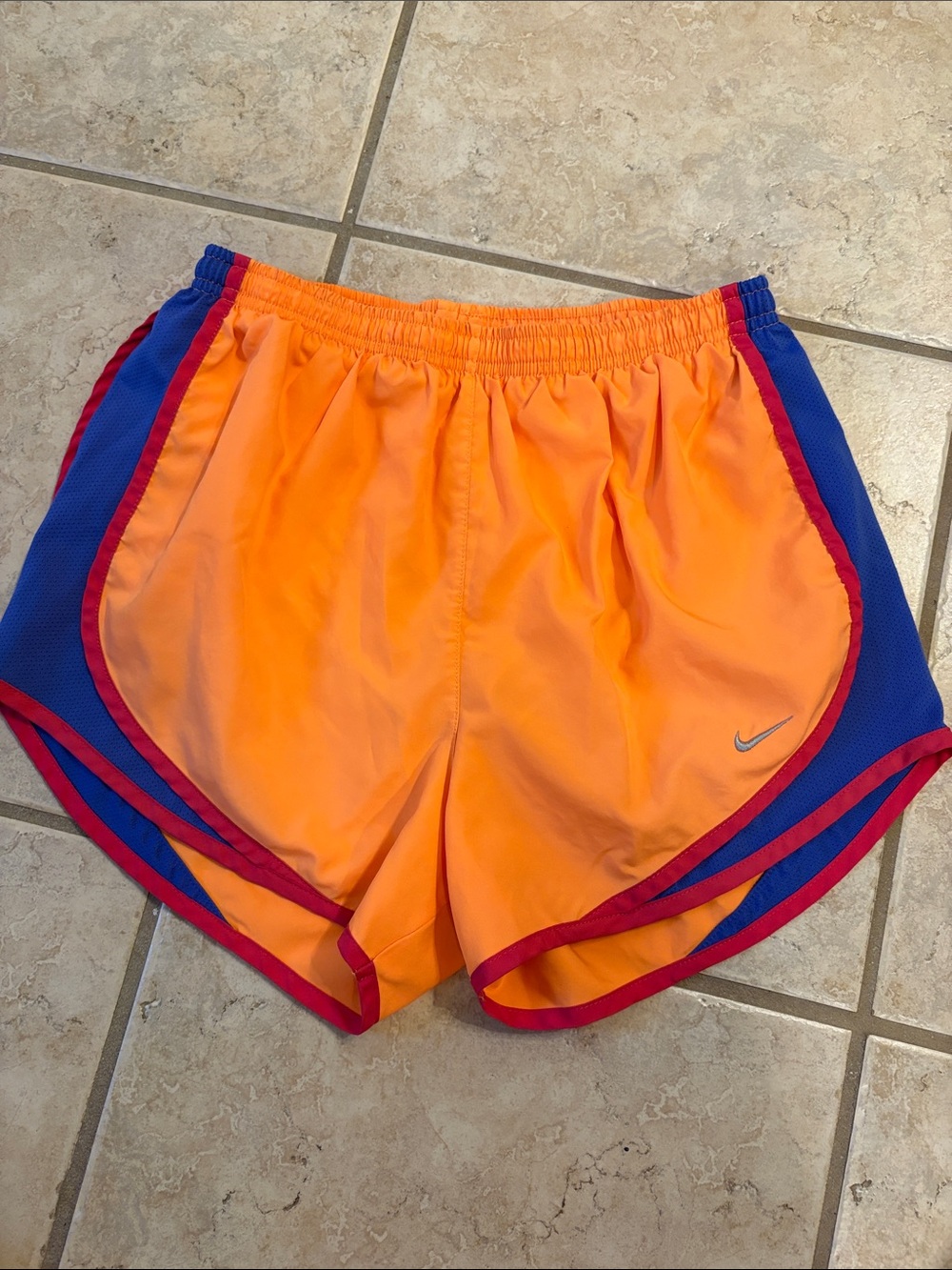 Nike Women’s Orange Athletic Shorts with Blue Panels and Pink Trim